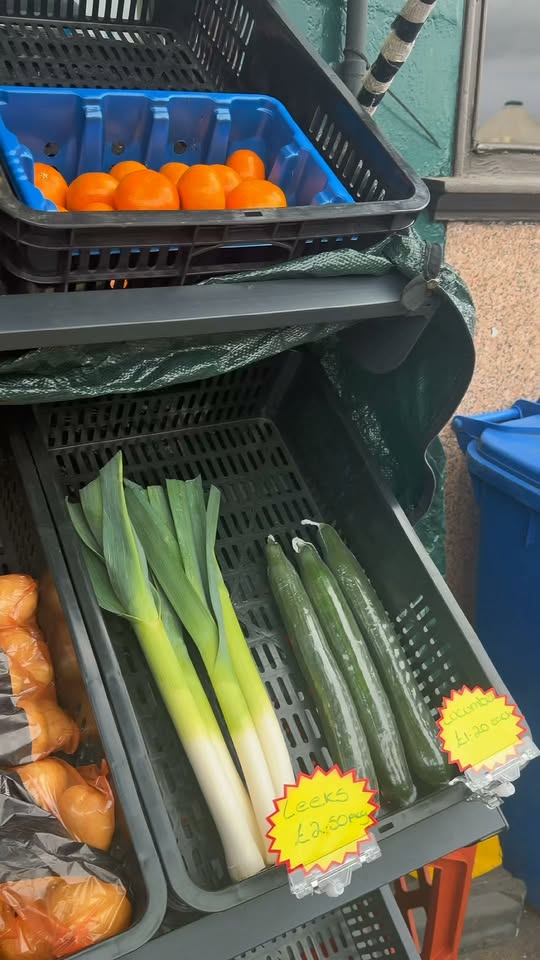 Fresh vegetables for sale outside Carlyles Fine Foods